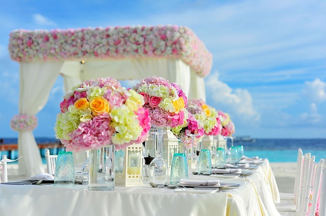 bright colours wedding flowers laid out on table at wedding