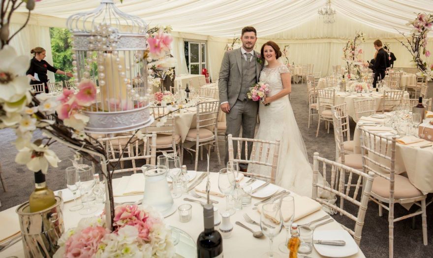 Bride and Groom at their wedding breakfast at Soughton Hall | Confetti.co.uk