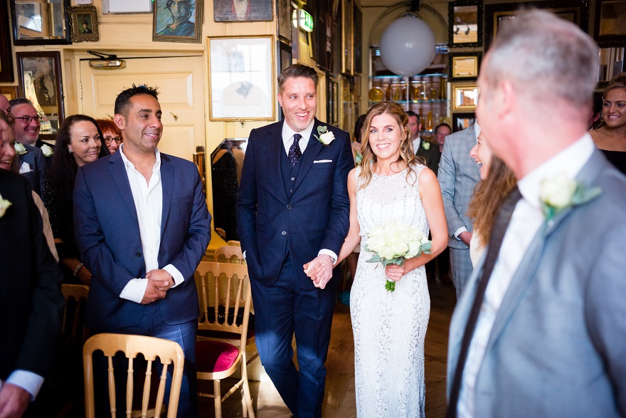 Bride & Groom walking down the aisle of their Soho City Wedding | Confetti.co.uk