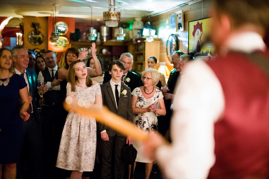 Groom playing guitar at soho city wedding | Confetti.co.uk