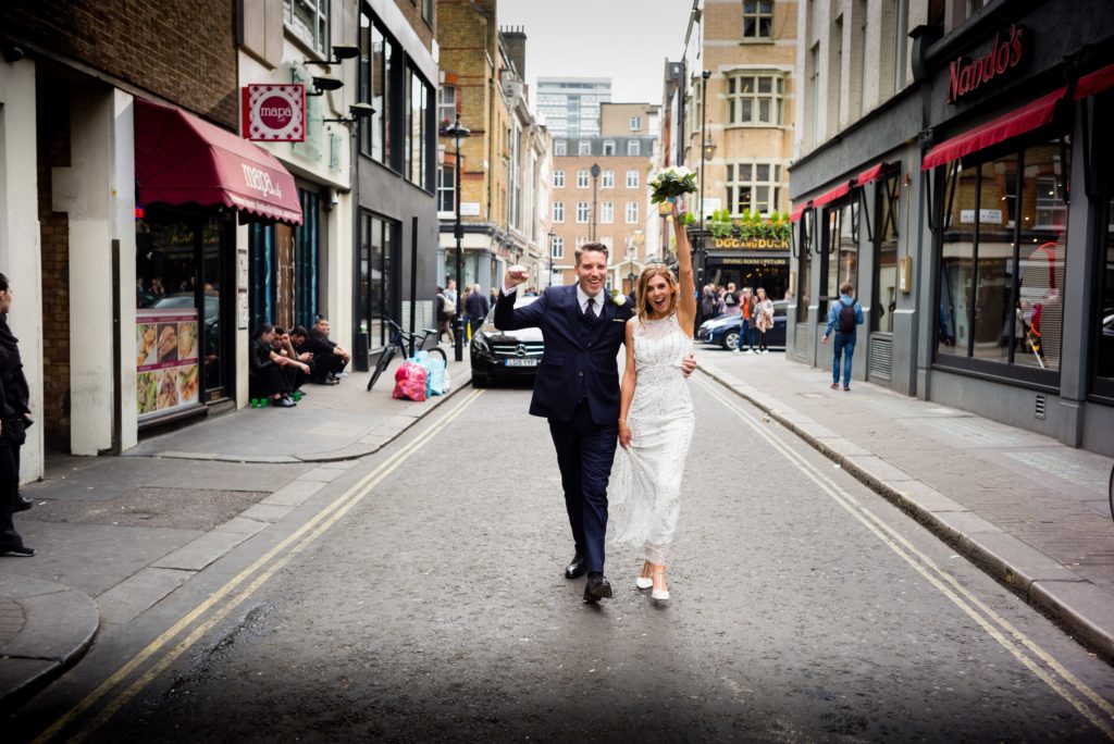 Laura and Andy Real Wedding Douglas Fry Photography in the street | Confetti.co.uk