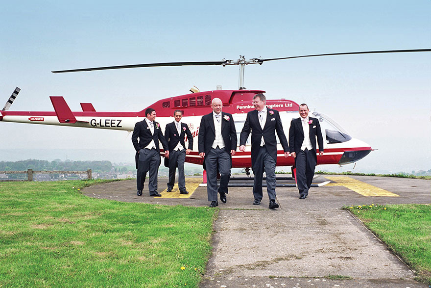 Pennine Manor Helicopter Pad with Groomsmen and Pennine Helicopters Ltd | Confetti.co.uk