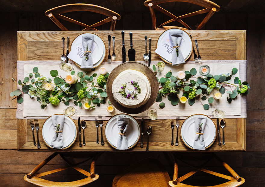 Spring Rustic White Green and Yellow Wedding Reception Cake Table with Place Settings | Confetti.co.uk