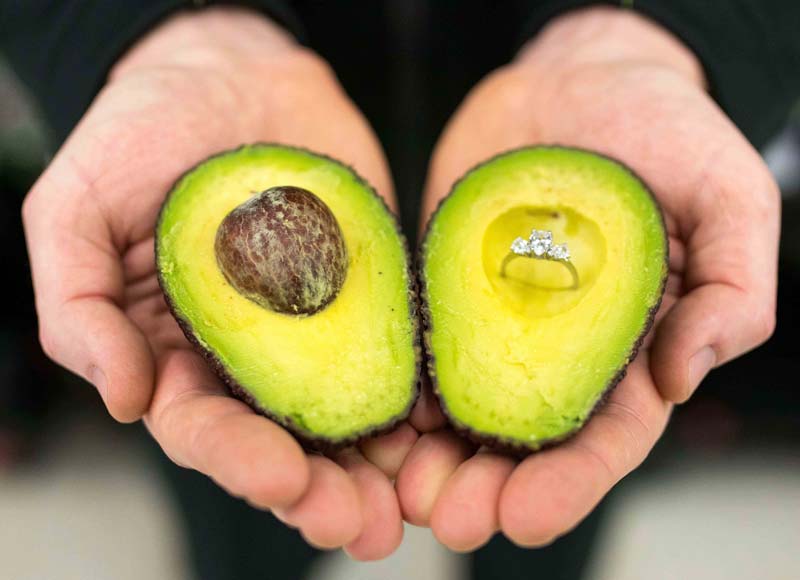 Engagement ring embedded in an avocado