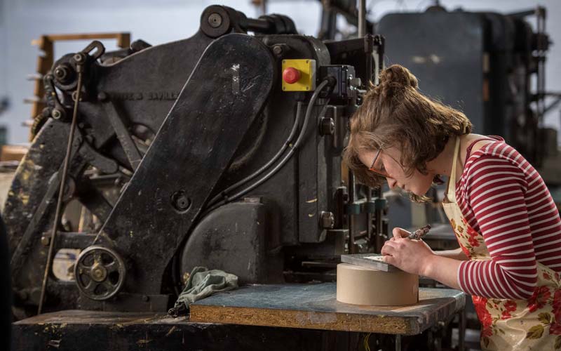 Lottie Small creating royal wedding invitations