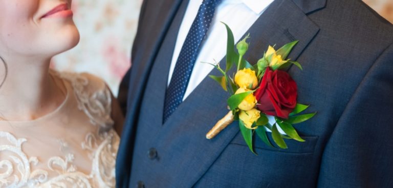 Buttonhole in red and yellow | Confetti.co.uk