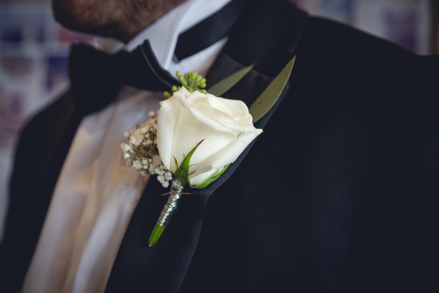 White rose buttonholes for a black tie wedding | Confetti.co.uk