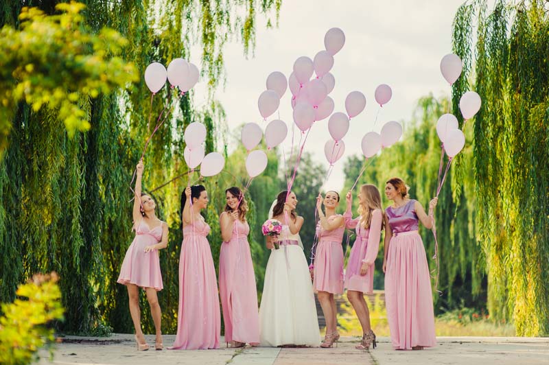 Bride and bridesmaids with balloons