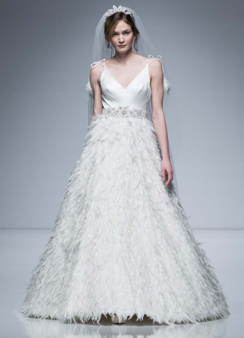 Designer wedding dress with feathered skirt