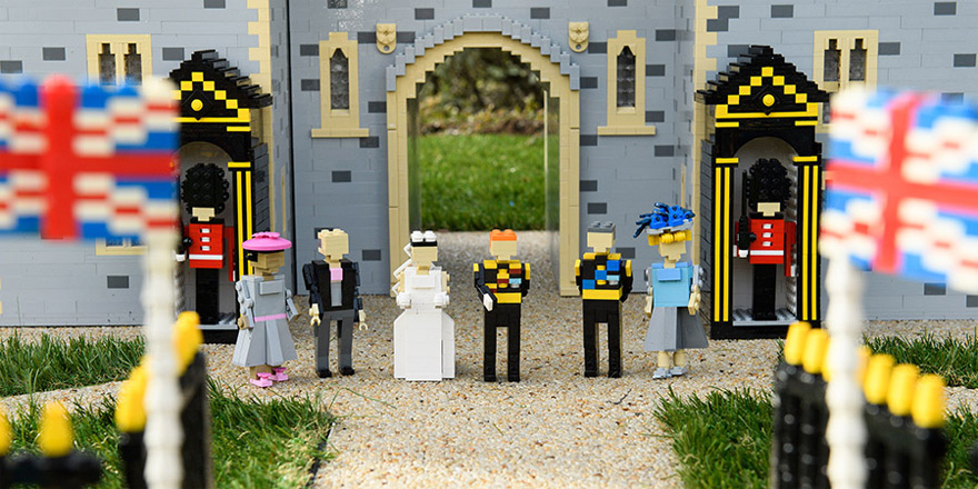 Prince Harry and Meghan Markle's LEGO Windsor Castle Model with LEGO Charles and Camilla and Meghan Markle's LEGO Parents as well as LEGO Foot Guards and LEGO Union Jack Flags | Confetti.co.uk