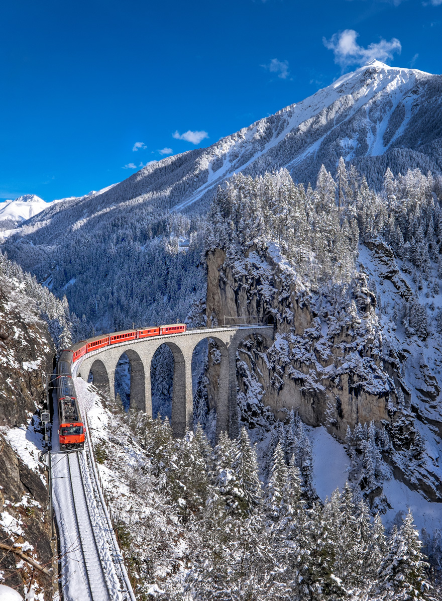 Best Honeymoon Destinations for Winter Weddings - Switzerland Honeymoon Ideas - Glacier Express Train Tour with Jungfrau Mountain in Winter by Alessandro Colle on Shutterstock | Confetti.co.uk