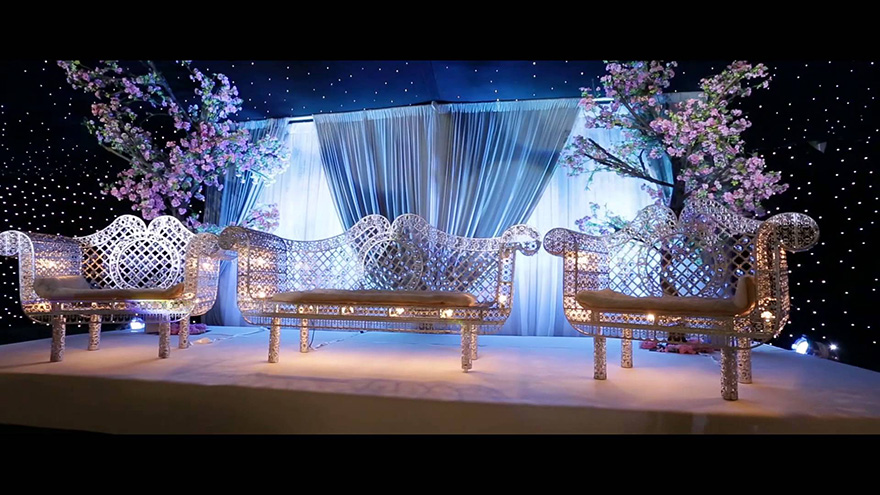 Newland Manor Civil and Asian Wedding Venue in Buckinghamshire - Cinematic Highlights of Faraaz and Sofia Wedding at Newland Manor from Image UK Photography - Lit Up Couple's Throne with Trees and Drapes - Stunning Wedding Lighting Ideas | Confetti.co.uk