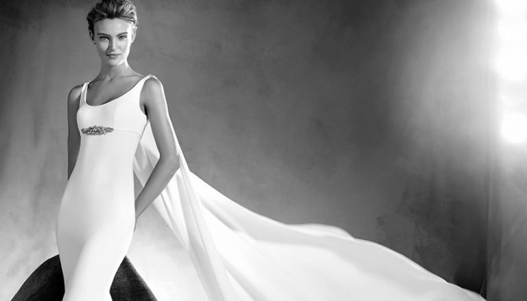 Superhero Wedding Dress - Edurne by Pronovias Atelier - Simple and Beautiful Mermaid Wedding Dress with Round Neckline, Thin Straps, Long Fluid Cape and Gemstone Details - Wedding Dresses with Capes Thumbnail | Confetti.co.uk