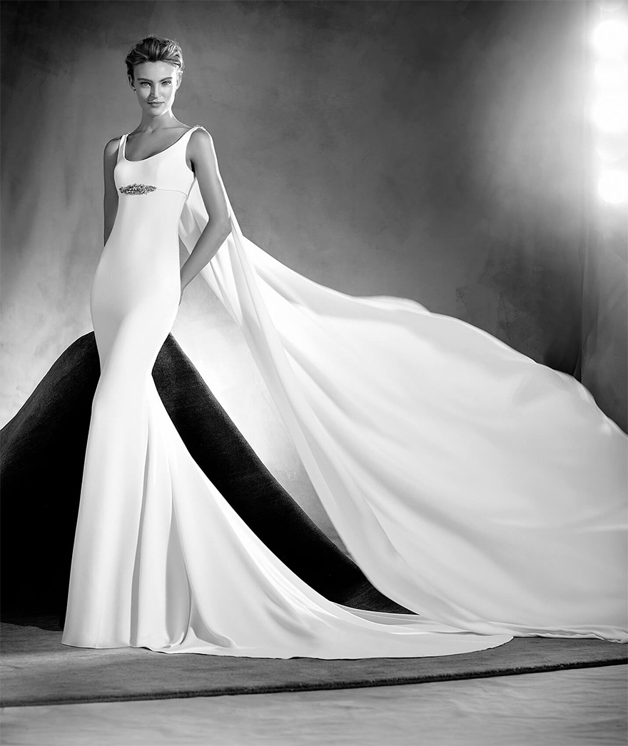 Superhero Wedding Dress - Edurne by Pronovias Atelier - Simple and Beautiful Mermaid Wedding Dress with Round Neckline, Thin Straps, Long Fluid Cape and Gemstone Details - Wedding Dresses with Capes | Confetti.co.uk