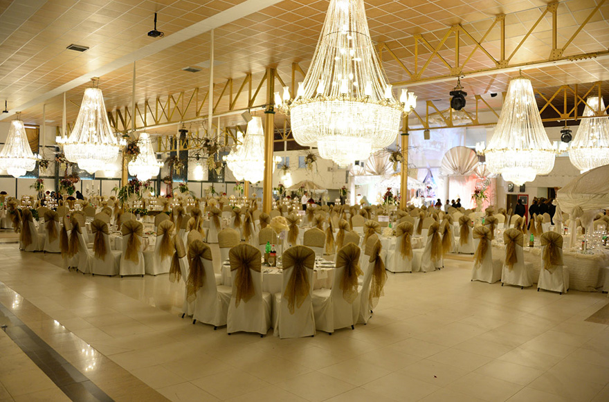 The Royal Hall at Bolton Excellency Wedding and Exhibition Centre - Glamorous Asian Wedding Venues in Bolton - Large Capacity Wedding Venue Wedding Banqueting Hall with Hanging Chandeliers | Confetti.co.uk