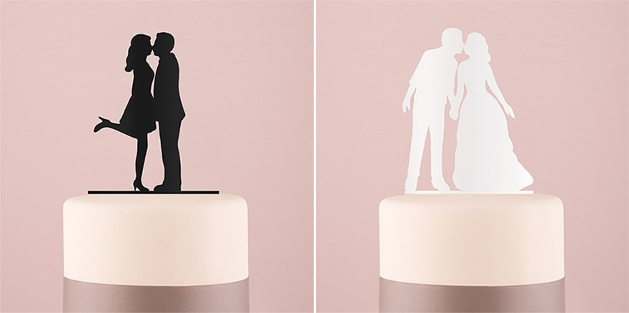 Acrylic Black and White Silhouette Couple Cake Toppers - Black "A Kiss" Silhouette Acrylic Cake Topper and White "With A Kiss" Silhouette Acrylic Cake Topper | Confetti.co.uk