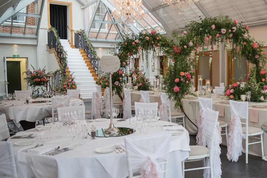 Botleys Mansion Glass-Roofed Atrium - Stairs Wedding Aisle - Creative Wedding Venue Decor | Confetti.co.uk