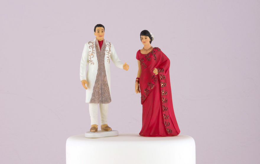 Traditional Indian Bride in Red Sari and Traditional Indian Groom Figurine Cake Toppers | Confetti.co.uk