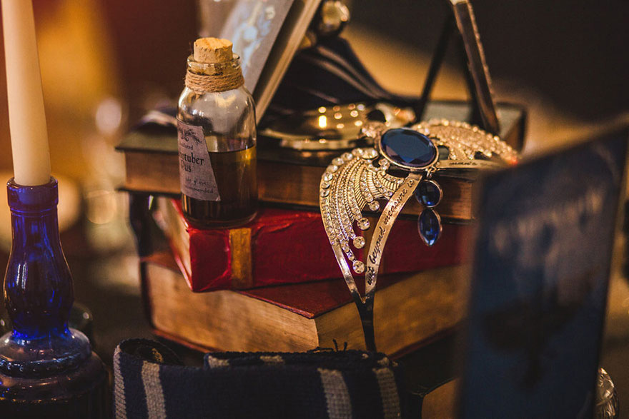 Harry Potter Themed Wedding by Kelly Clarke Photography - Diadem of Ravenclaw - Piled Books Harry Potter Wedding Centrepiece Idea | Confetti.co.uk