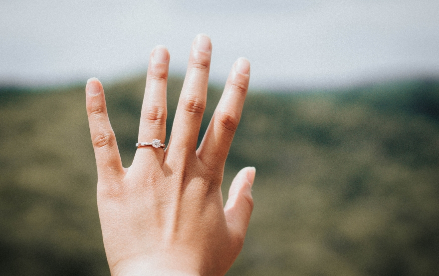 Engagement ring on finger