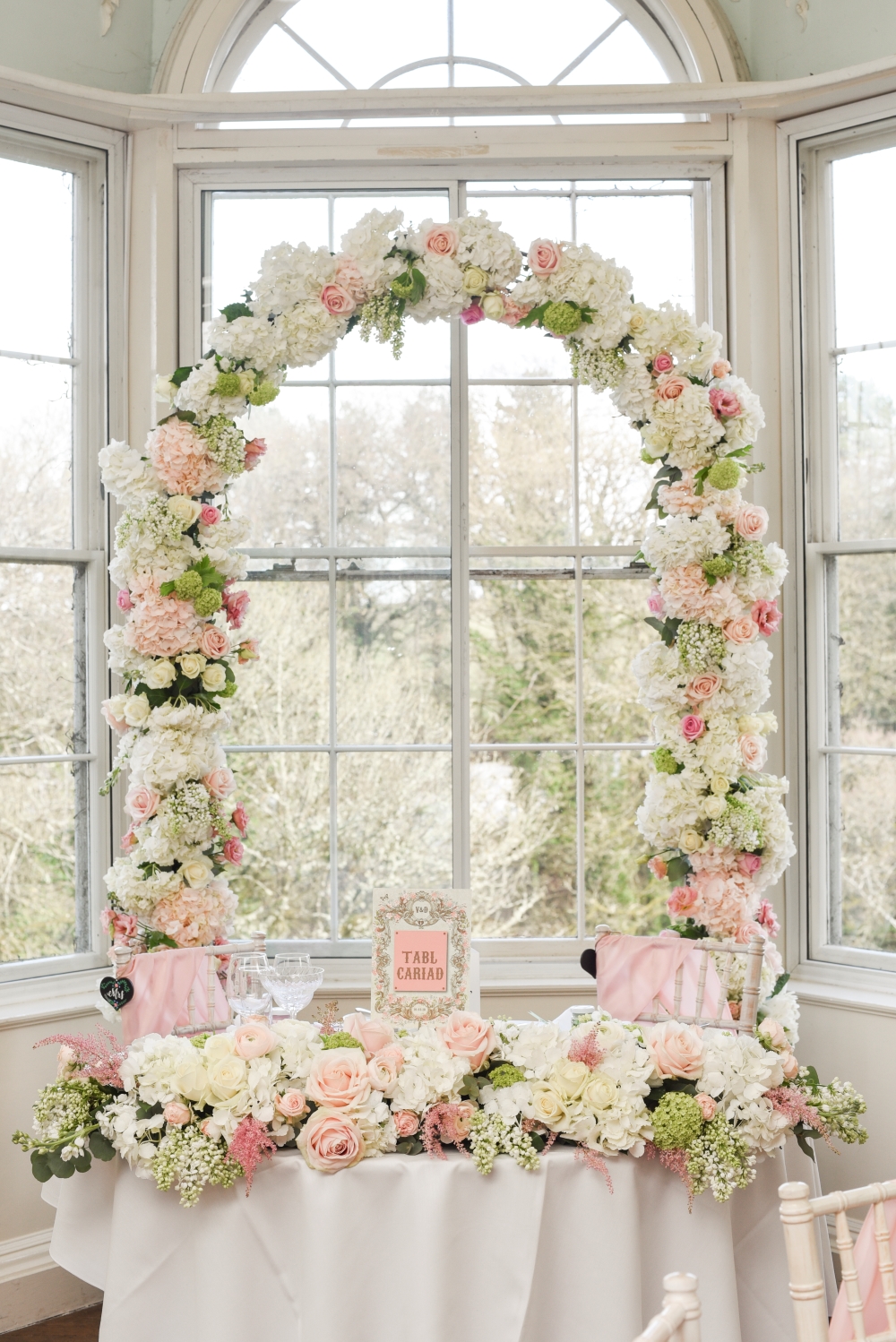 pink-and-white-floral-wedding-arch