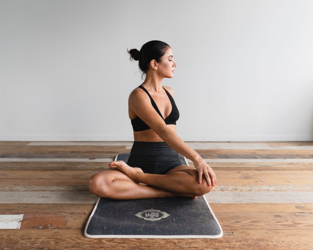 Yoga beginner practising at home