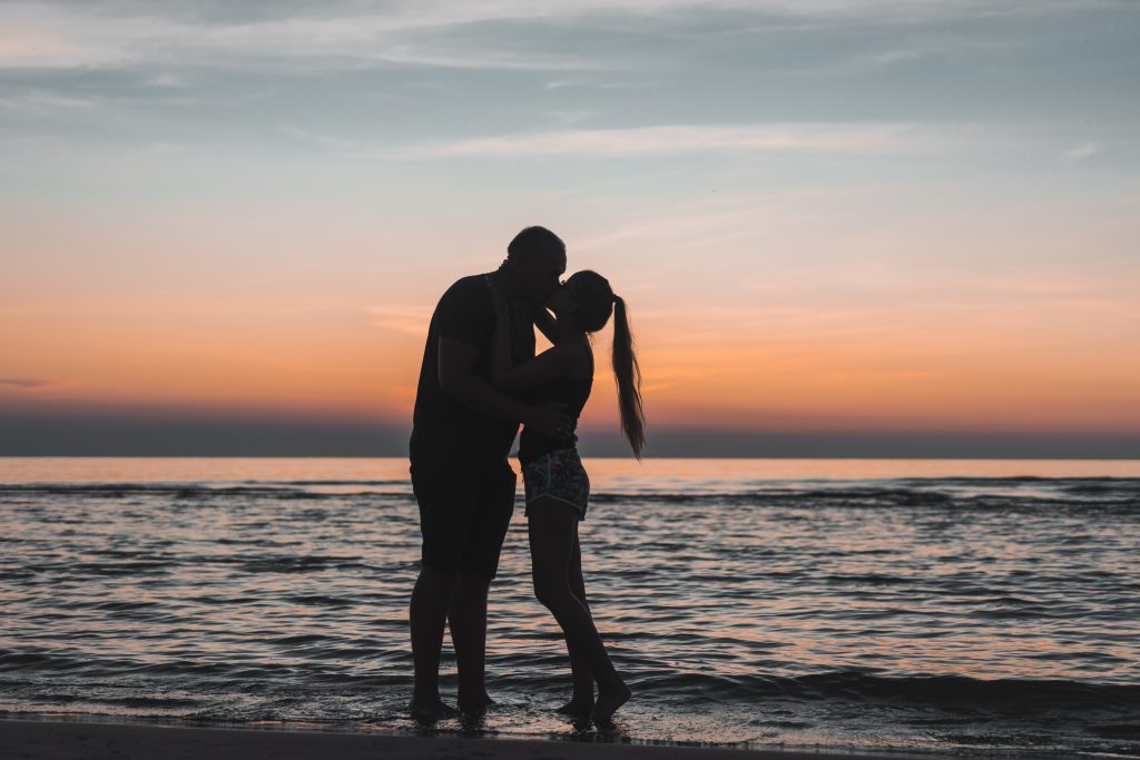 couple-on-beach-why-is-it-called-a-honeymoon